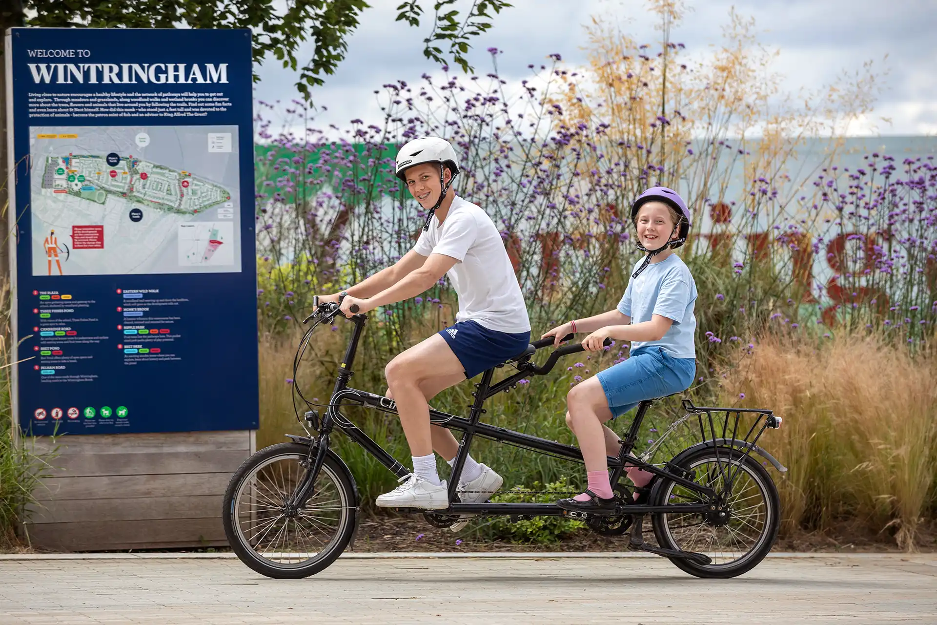 Young people on a tandem bike